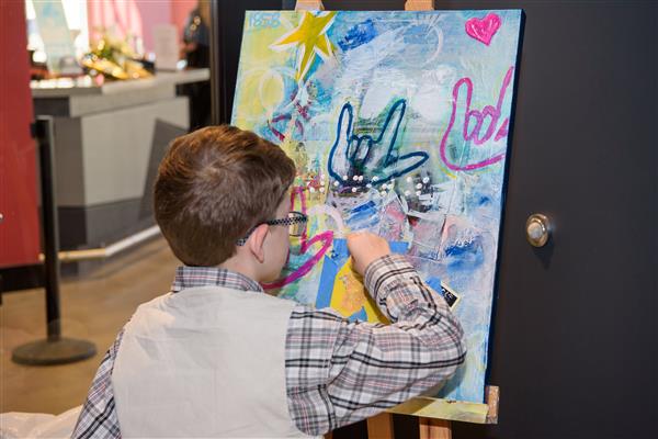 Gerry Russell focused on painting.